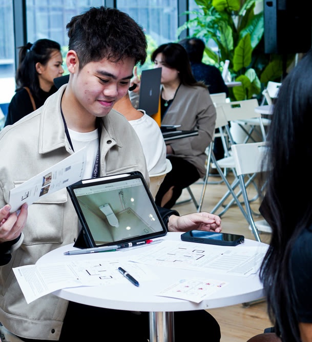 Homeowner reviewing a 3D design of his floorplan on a tablet